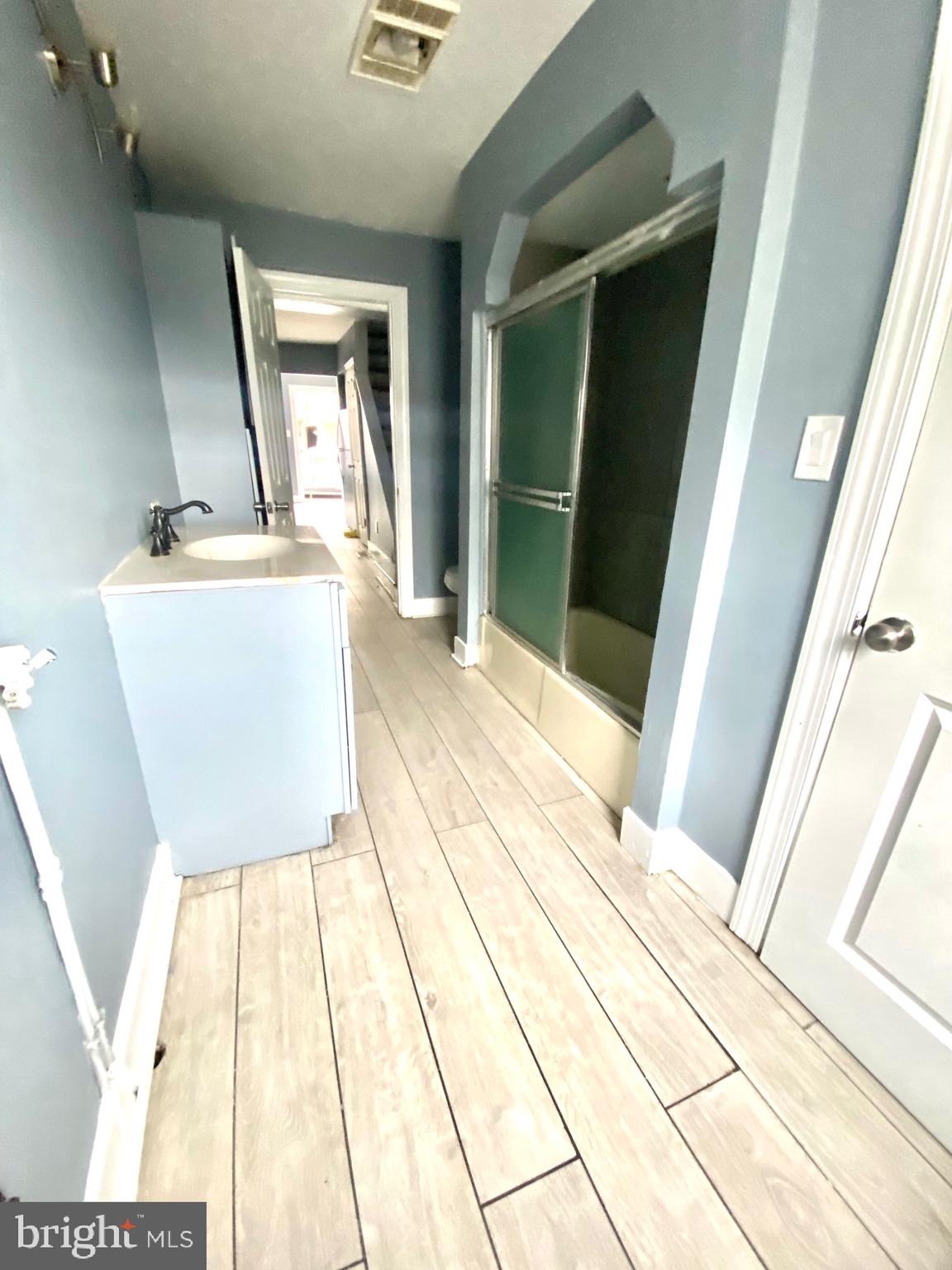 1163 Cotton Street Reading, PA 19602 - Photo 12 of 25 a living room with a toilet and a mirror