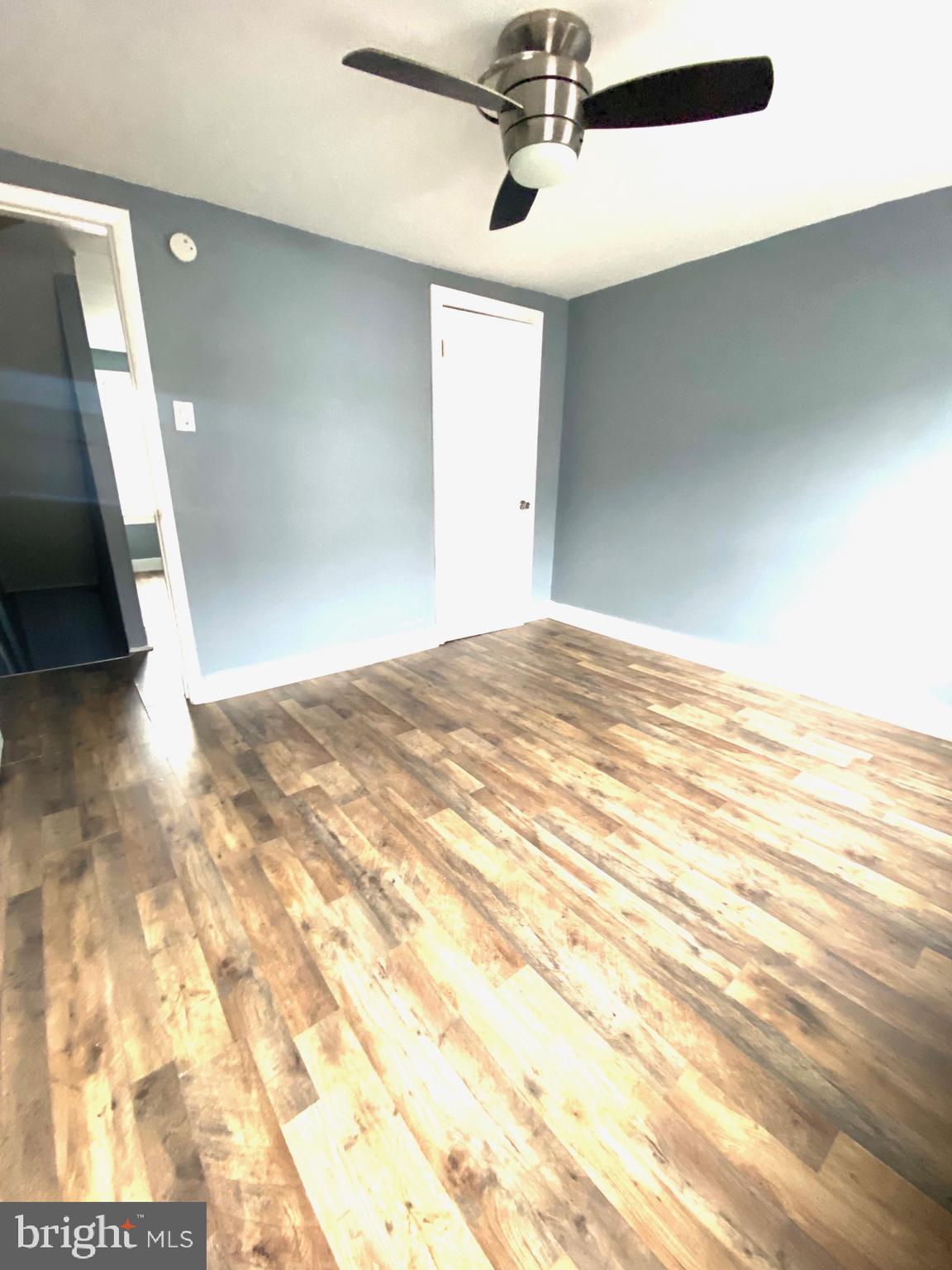 1163 Cotton Street Reading, PA 19602 - Photo 15 of 25 a view of a big room with wooden floor and staircase