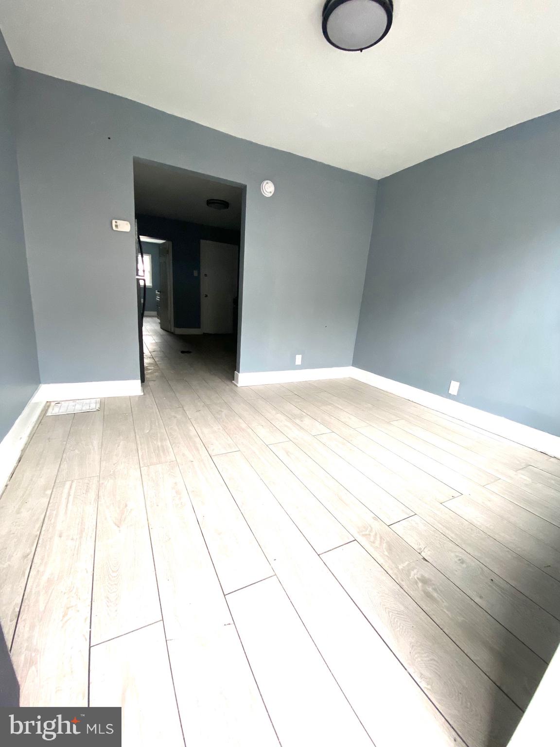 1163 Cotton Street Reading, PA 19602 - Photo 2 of 25 a view of an empty room with wooden floor