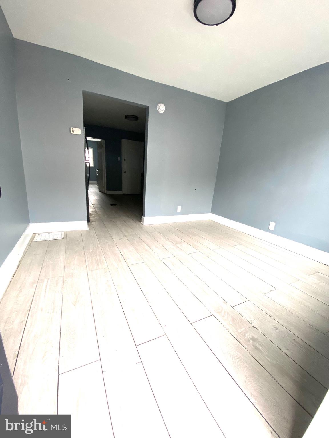 1163 Cotton Street Reading, PA 19602 - Photo 3 of 25 a view of an empty room with wooden floor