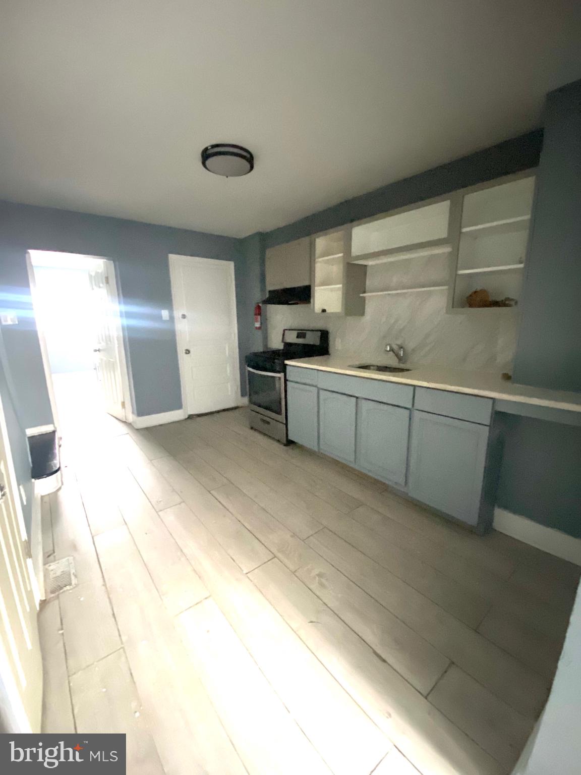 1163 Cotton Street Reading, PA 19602 - Photo 5 of 25 a large kitchen with cabinets and a sink