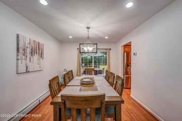 a view of a dining room with furniture window and outside view