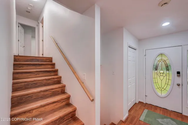 a view of entryway with a front door