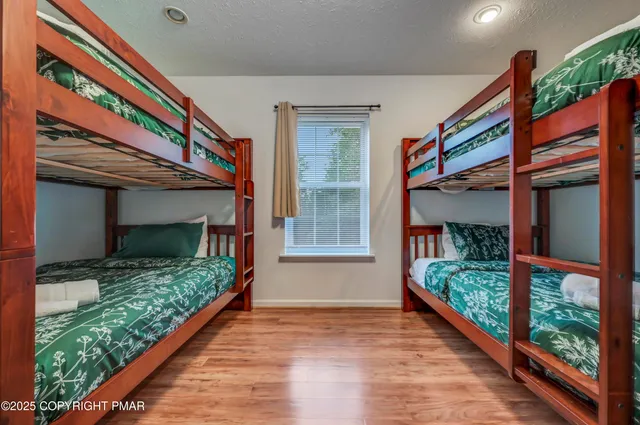 a bedroom with a bed and a table in it