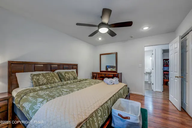 a bedroom with a bed and a lamp