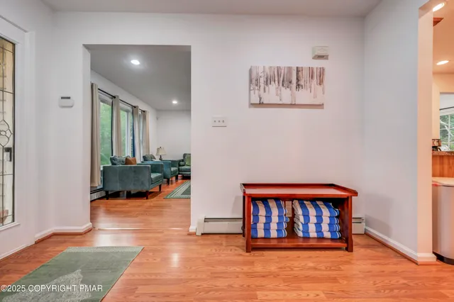 a room with furniture and pool table