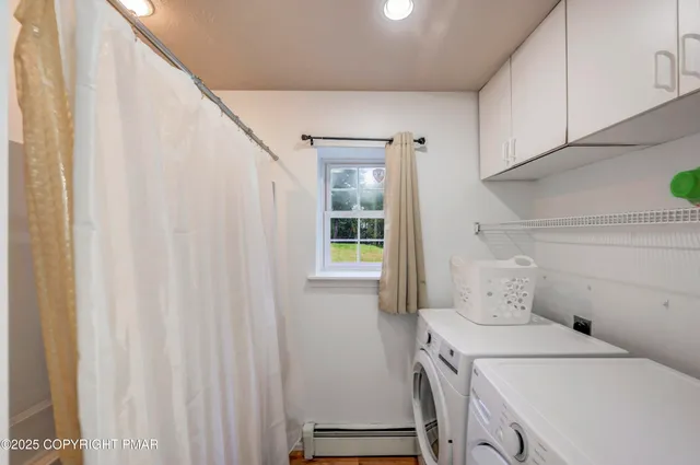 a view of a deck with couches under an umbrella