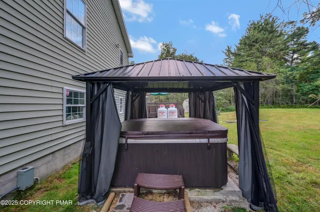 a view of a porch with a table and chair