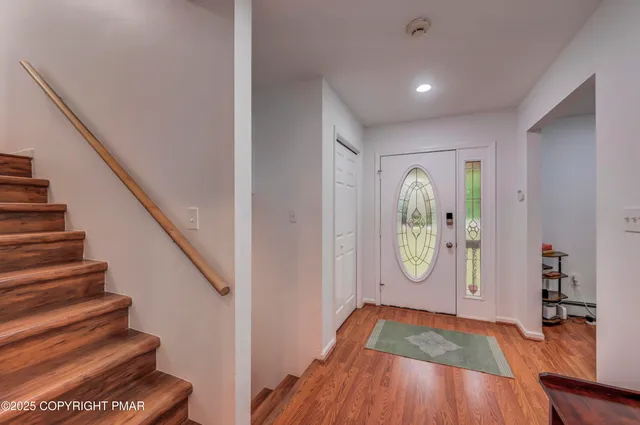 a view of entryway with wooden floor