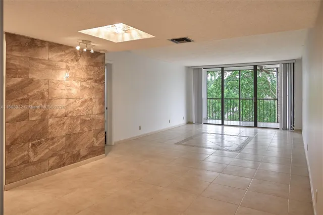 a view of a lake and houses in the back