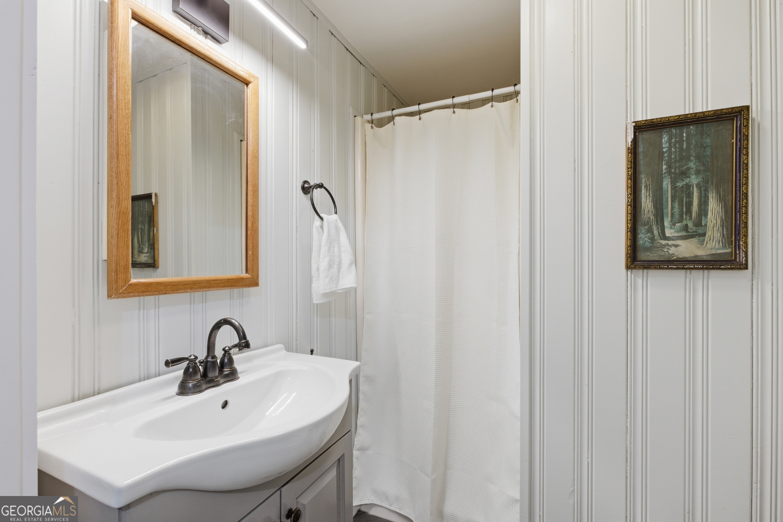1921 Franklin Road Highlands, NC 28741 - Photo 26 of 72 a bathroom with a sink and a mirror