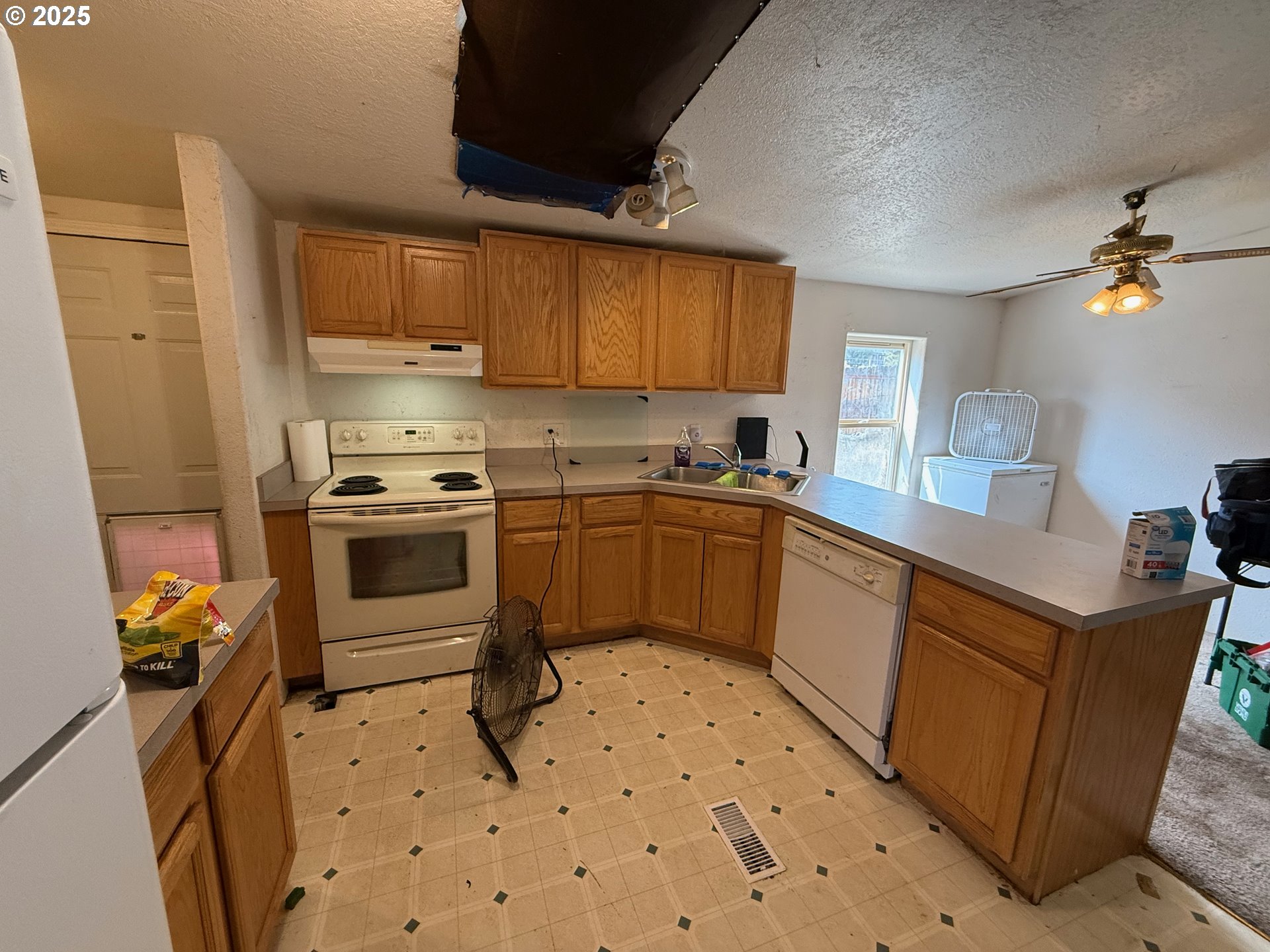 9071 Southwest Sand Ridge Road Terrebonne, OR 97760 - Photo 11 of 40 a kitchen with a sink appliances and cabinets