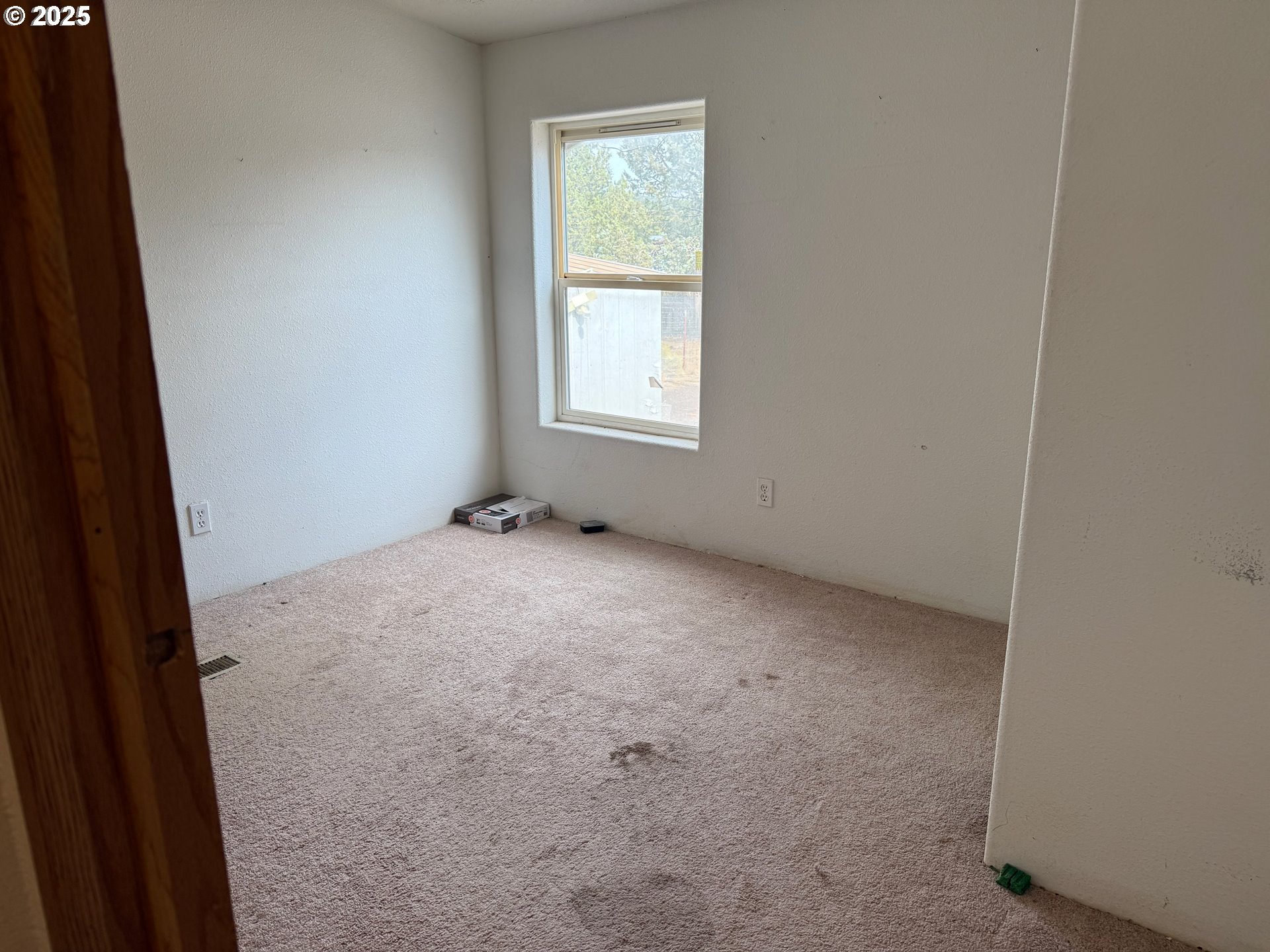 9071 Southwest Sand Ridge Road Terrebonne, OR 97760 - Photo 27 of 40 a view of an empty room with a window