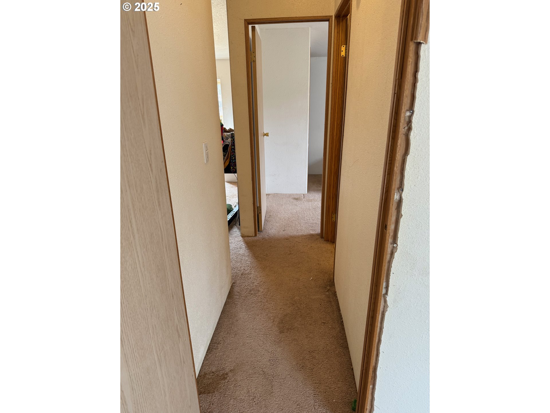 9071 Southwest Sand Ridge Road Terrebonne, OR 97760 - Photo 29 of 40 a view of a hallway with wooden floor