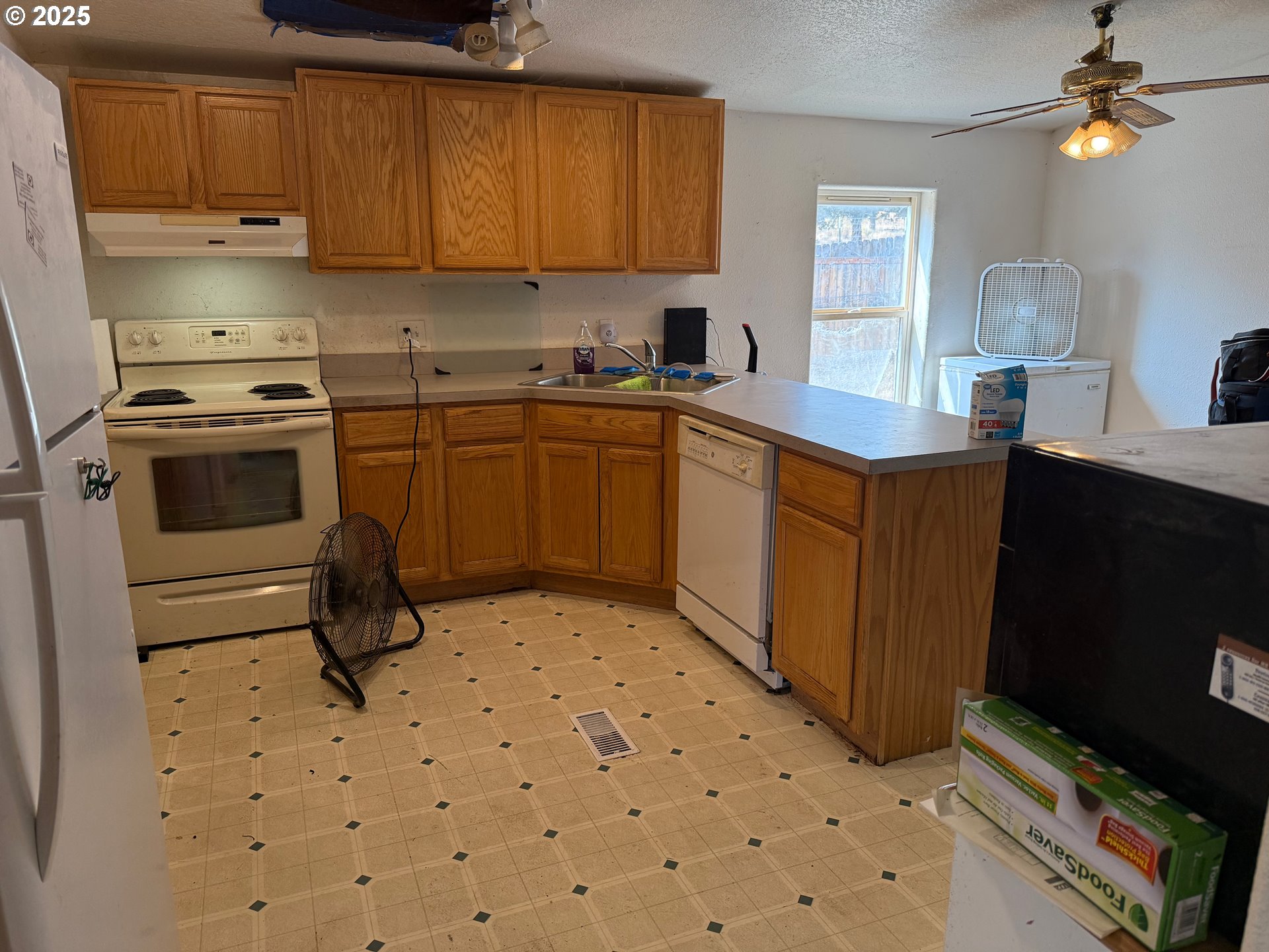 9071 Southwest Sand Ridge Road Terrebonne, OR 97760 - Photo 8 of 40 a kitchen with a sink cabinets and appliances