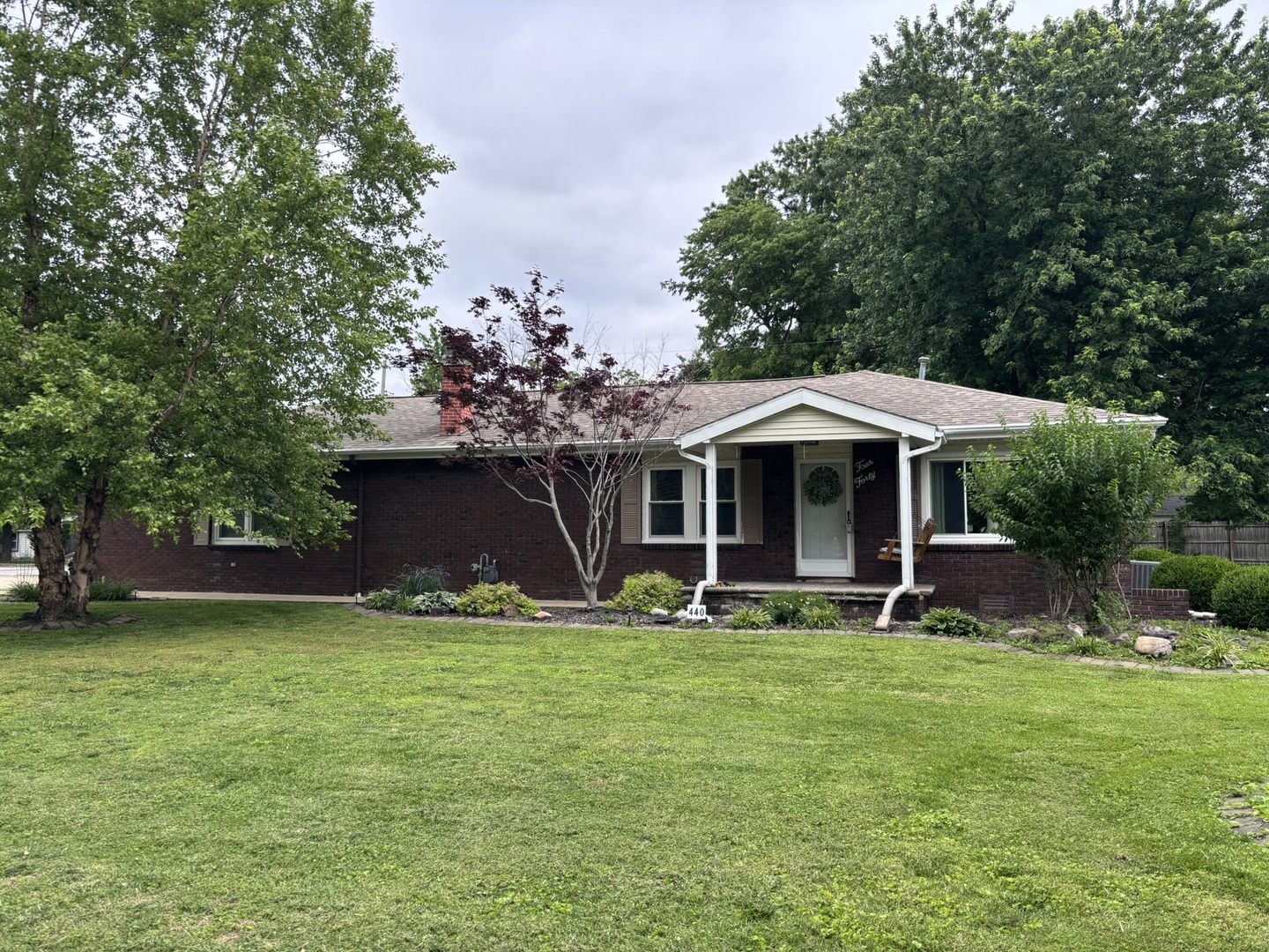 440 North Indiana Avenue Salem, IL 62881 - Photo 1 of 15 a front view of a house with garden and trees