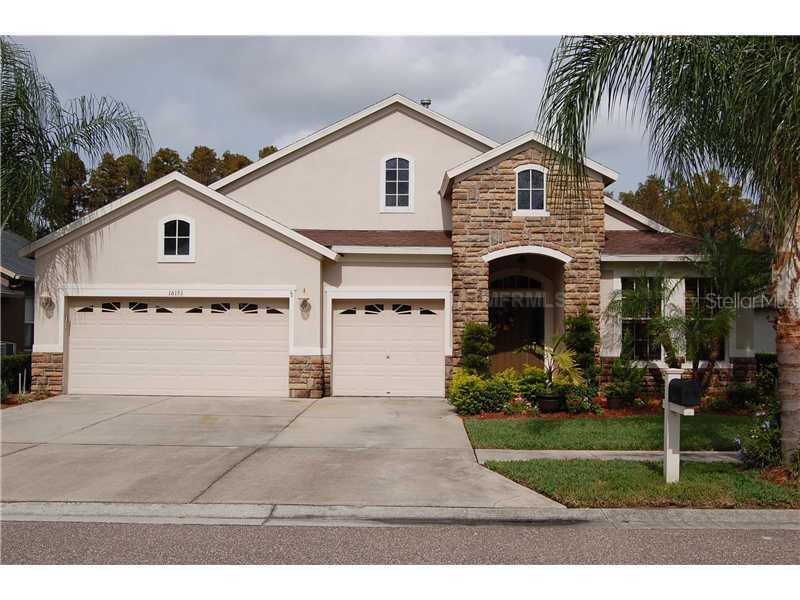16151 Rambling Road Odessa, FL 33556 - Photo 1 of 1 a front view of a house with garden