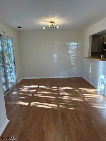 a view of room with window and a ceiling fan