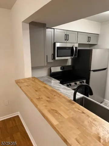 a bedroom with a bed and a microwave