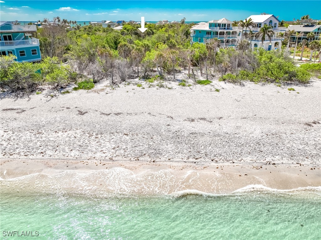 150 Hummingbird Drive Upper Captiva, FL 33924 - Photo 3 of 23 a view of a beach with a yard