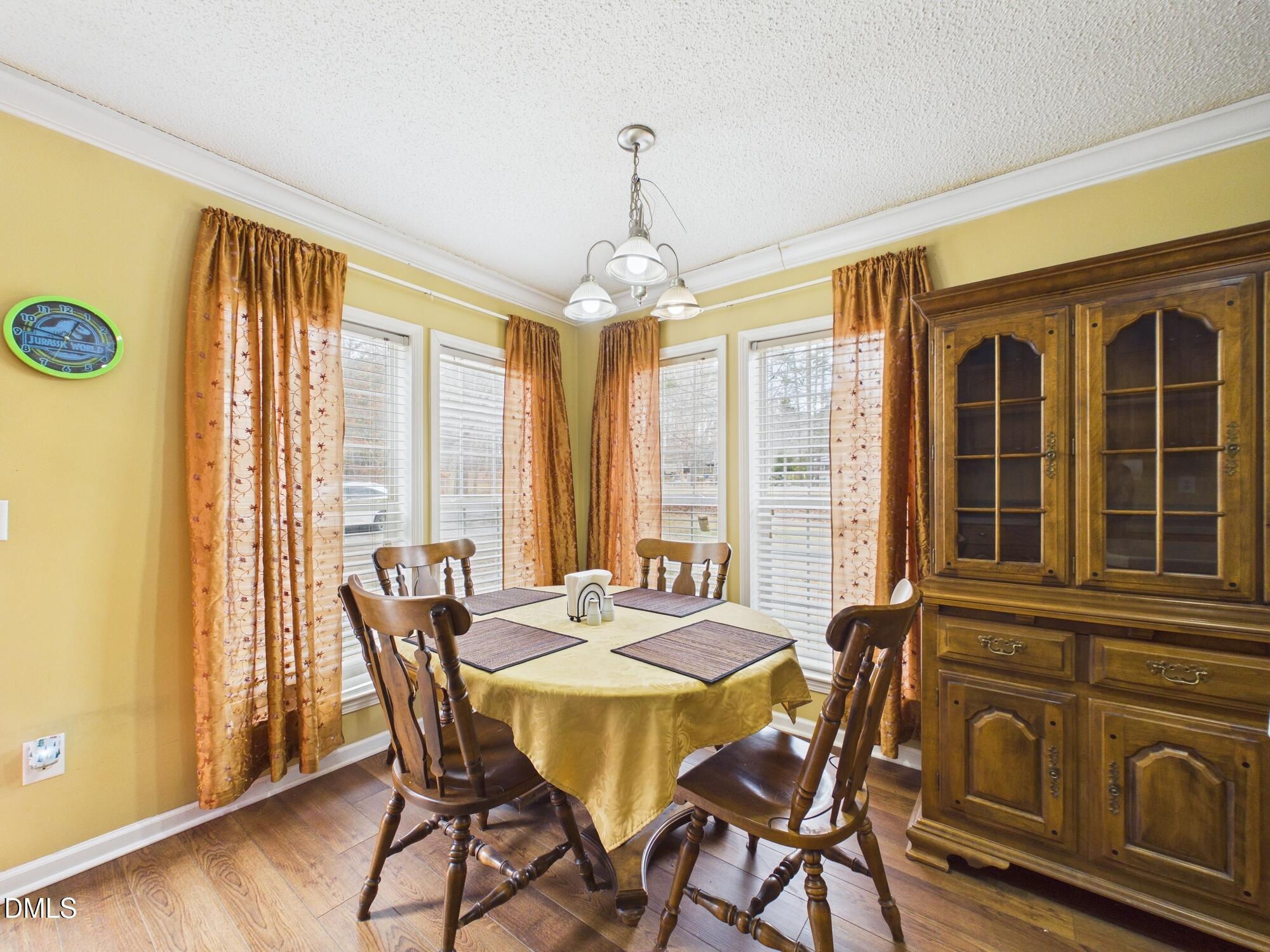 2528 Dalton Mill Road Bullock, NC 27507 - Photo 10 of 21 a view of a dining room with furniture window and wooden floor