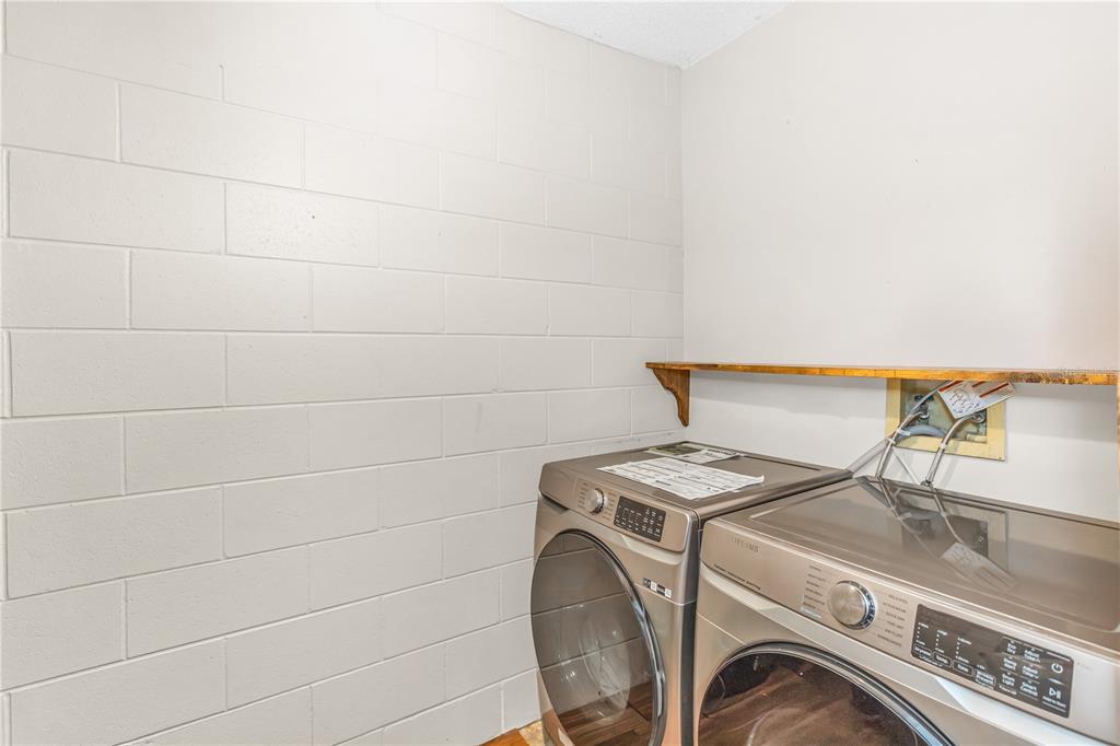 3137 Loblolly Street Deltona, FL 32725 - Photo 24 of 30 a utility room with dryer and washer