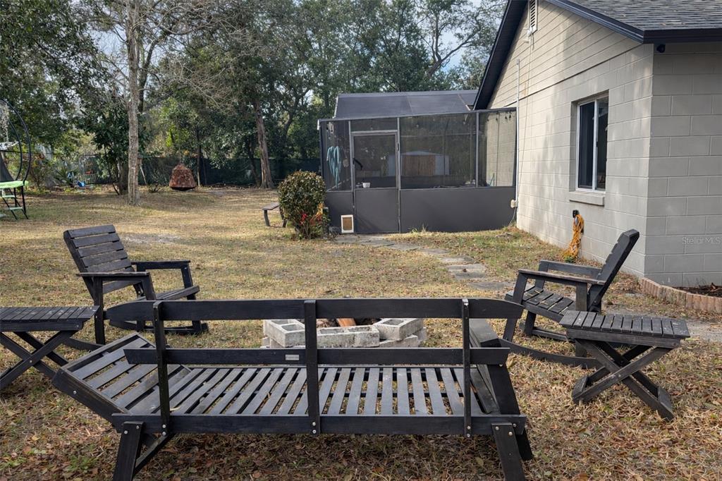 3137 Loblolly Street Deltona, FL 32725 - Photo 27 of 30 a view of a backyard with sitting area