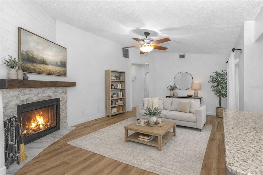 3137 Loblolly Street Deltona, FL 32725 - Photo 10 of 30 a living room with furniture and a fireplace