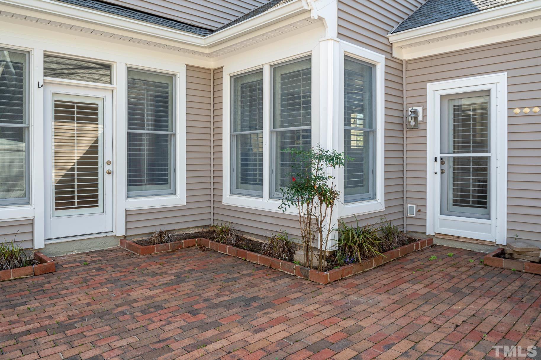 3 McDowell Pittsboro, NC 27312 - Photo 18 of 29 a view of house with backyard and glass windows
