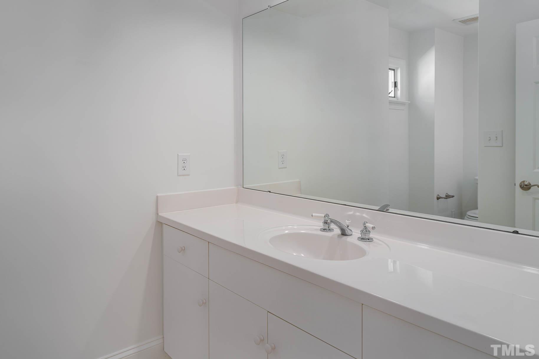 3 McDowell Pittsboro, NC 27312 - Photo 23 of 29 a bathroom with a sink and a mirror