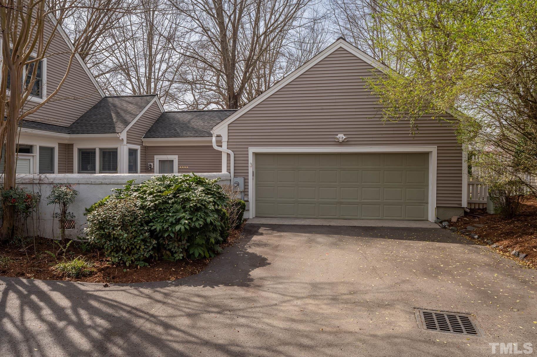 3 McDowell Pittsboro, NC 27312 - Photo 3 of 29 a front view of a house with a yard and garage