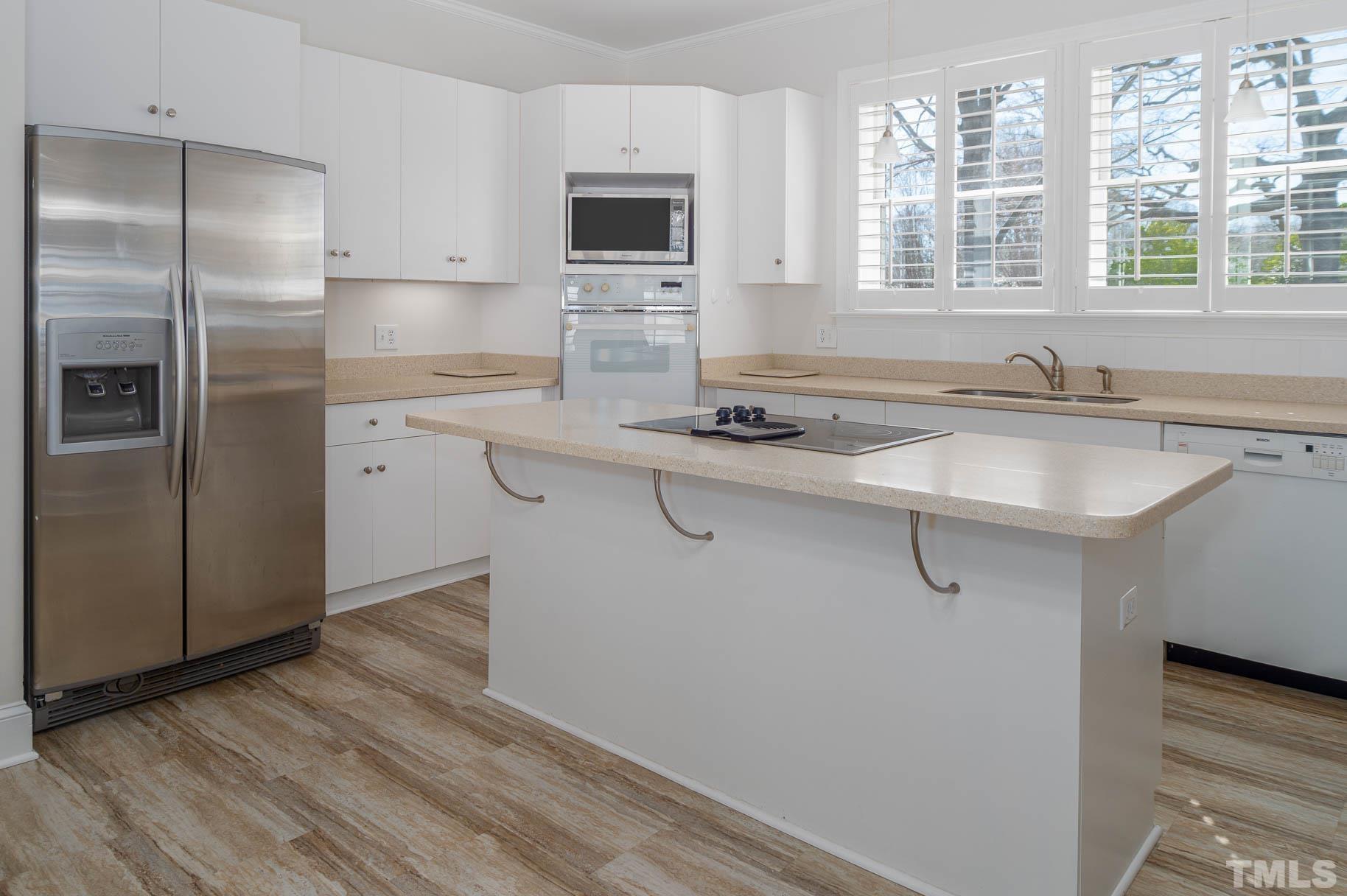 3 McDowell Pittsboro, NC 27312 - Photo 5 of 29 a kitchen with stainless steel appliances granite countertop a sink a stove and refrigerator