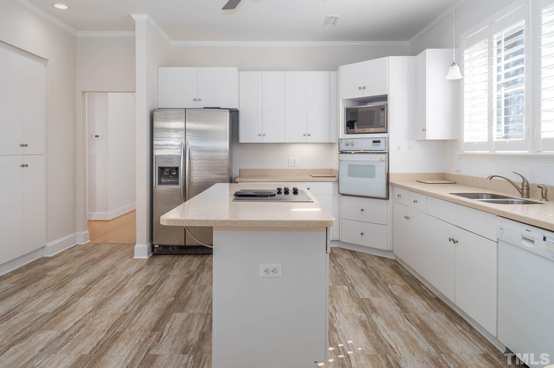 3 McDowell Pittsboro, NC 27312 - Photo 6 of 29 a kitchen with a sink stove and refrigerator