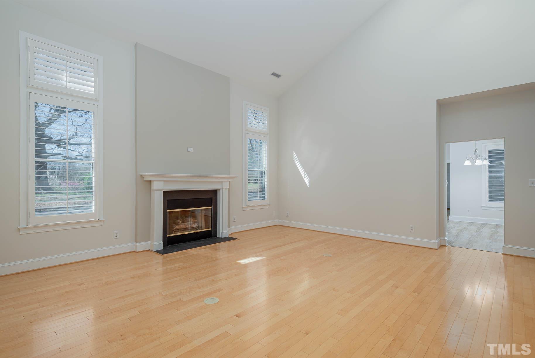 3 McDowell Pittsboro, NC 27312 - Photo 9 of 29 a view of an empty room with wooden floor fireplace and a window