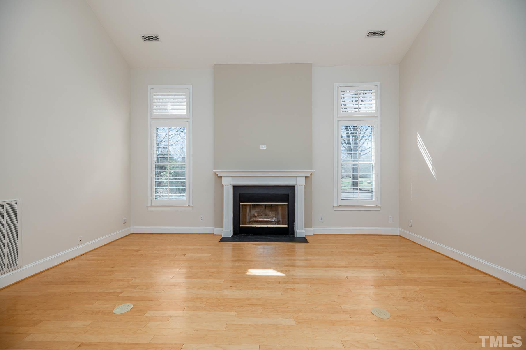 3 McDowell Pittsboro, NC 27312 - Photo 10 of 29 an empty room with a fireplace and windows