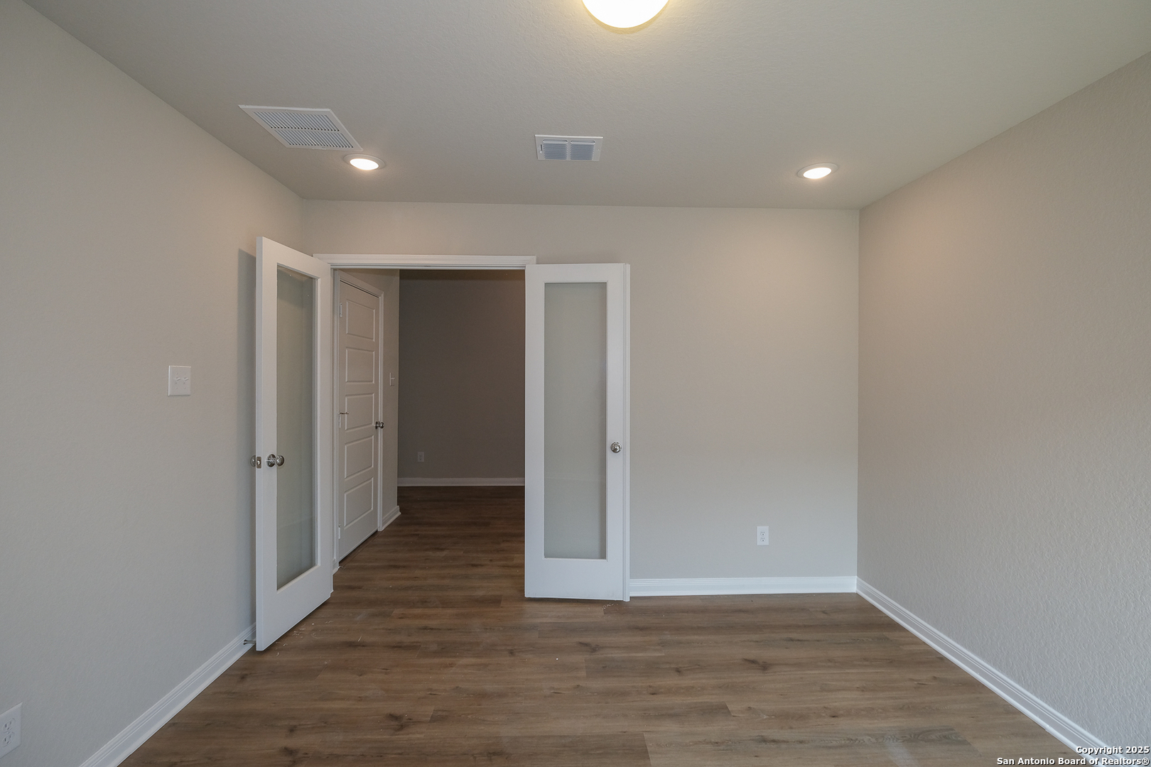 1124 Water Valley Seguin, TX 78155 - Photo 11 of 39 a view of an empty room with wooden floor