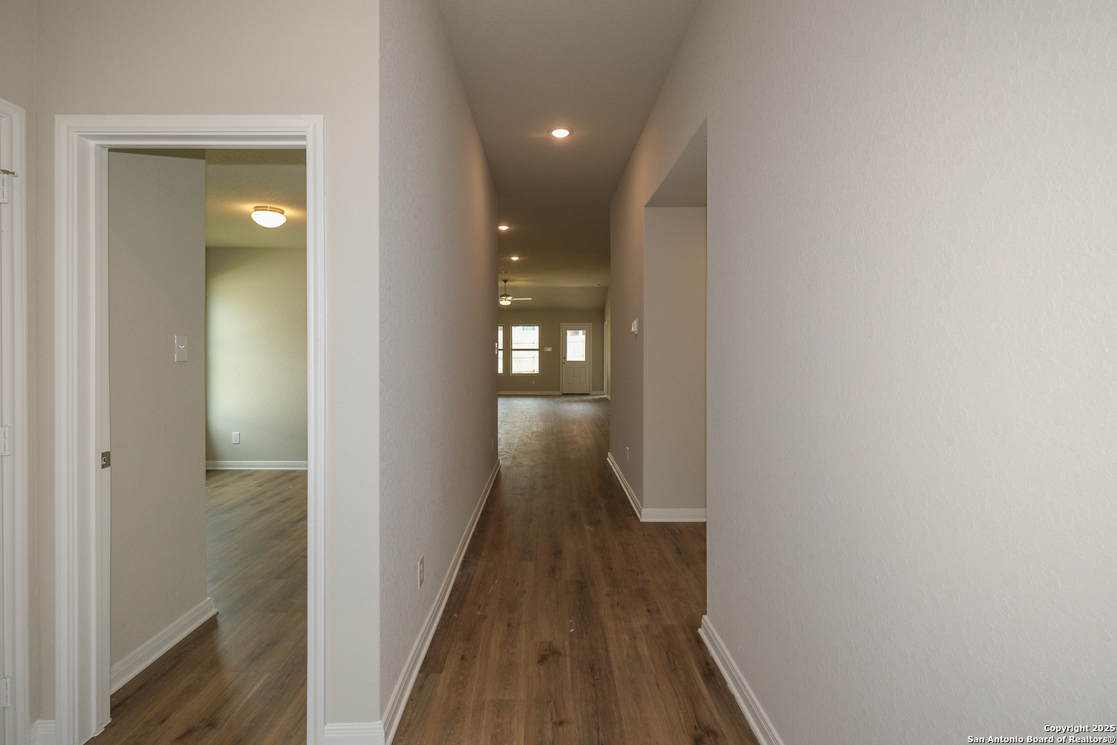 1124 Water Valley Seguin, TX 78155 - Photo 26 of 39 a view of a hallway with wooden floor