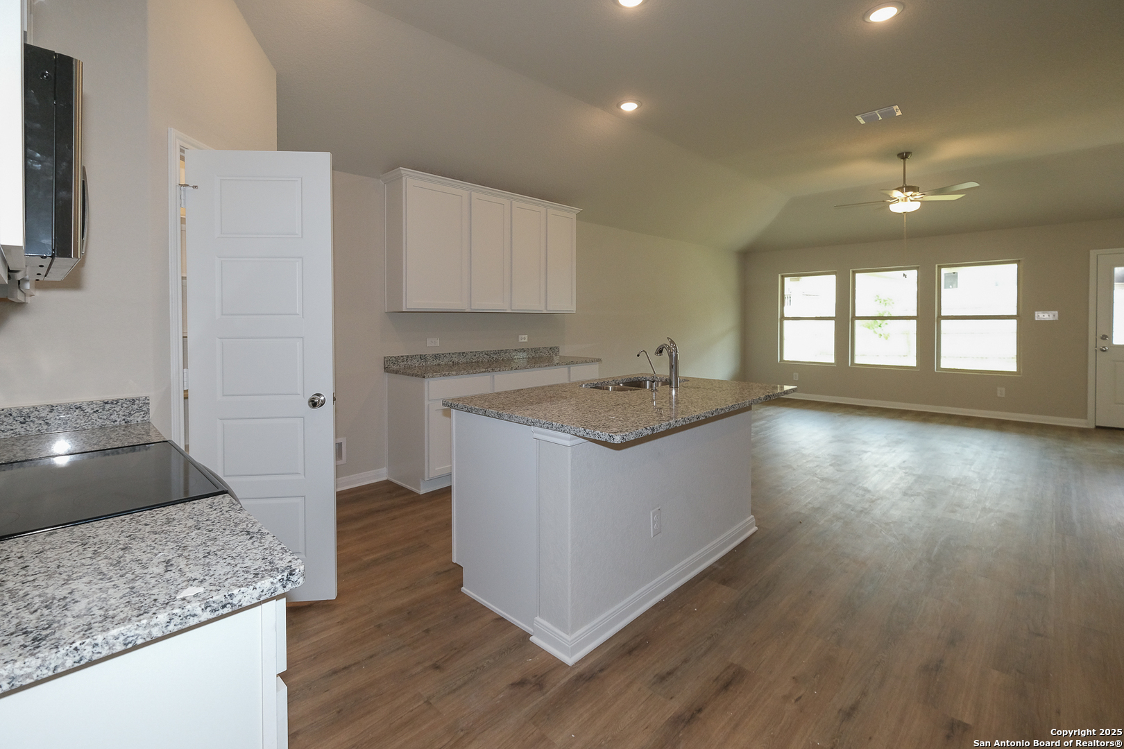 1124 Water Valley Seguin, TX 78155 - Photo 4 of 39 a kitchen with a sink cabinets and wooden floor