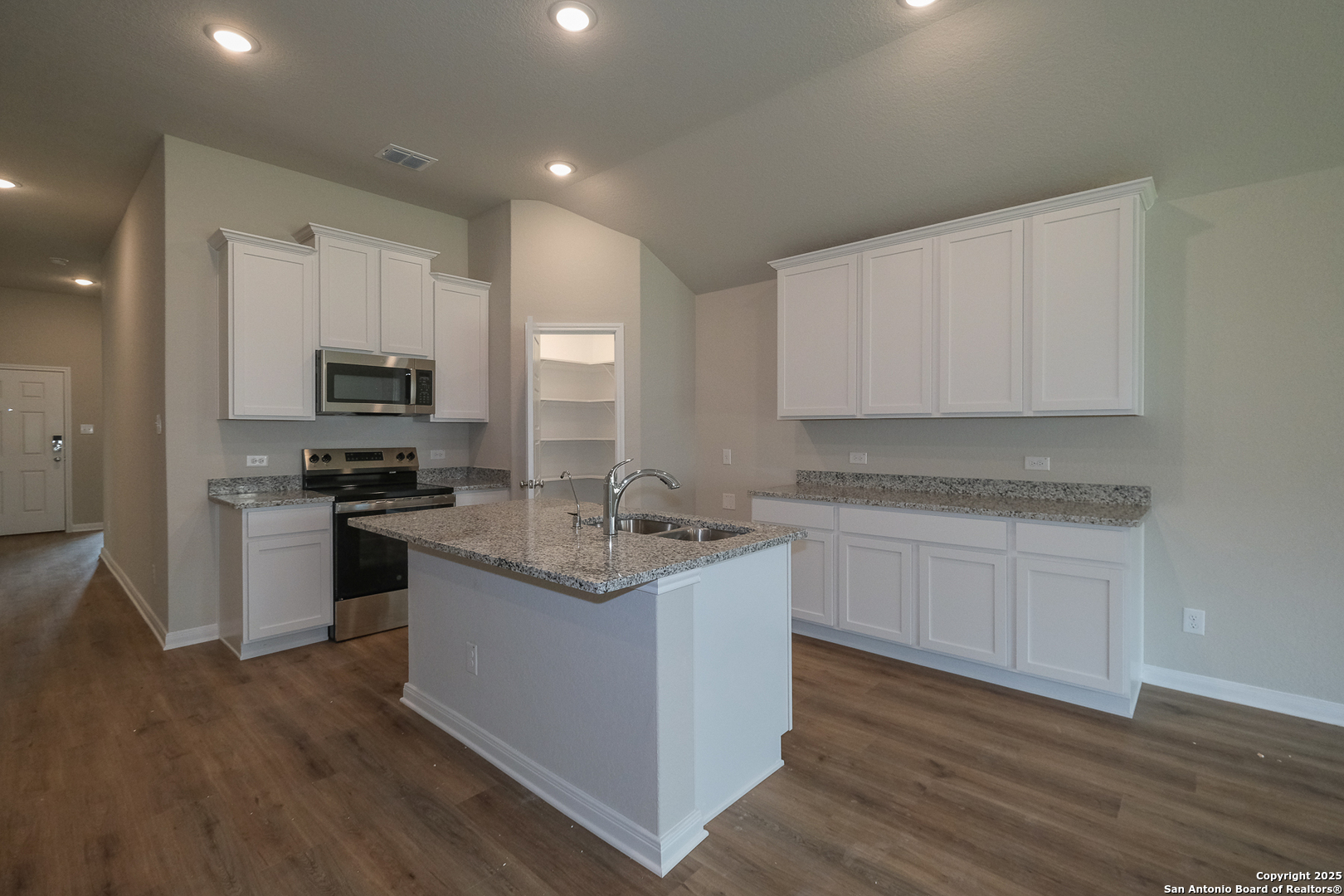 1124 Water Valley Seguin, TX 78155 - Photo 6 of 39 a kitchen with a sink cabinets and wooden floor