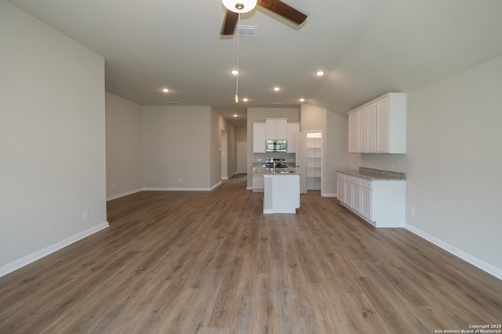 1124 Water Valley Seguin, TX 78155 - Photo 8 of 39 a view of kitchen with wooden floor electronic appliances and window