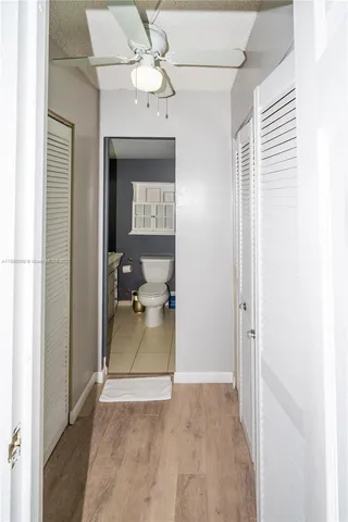 a view of a bathroom from the hallway