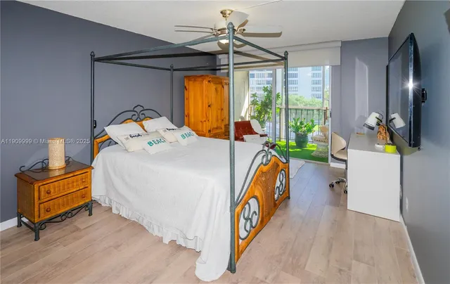 a bed room with a bed and a chandelier