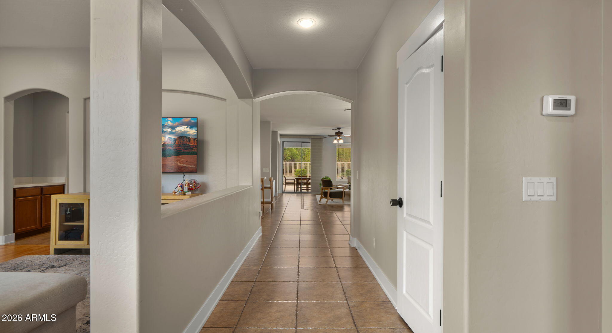3344 East Hopkins Road Gilbert, AZ 85295 - Photo 4 of 32 a view of a hallway with a livingroom and furniture