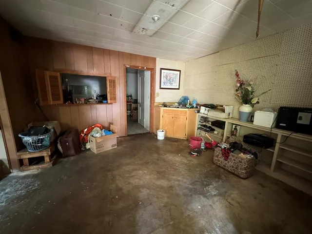 a living room with lots of furniture and a flat screen tv
