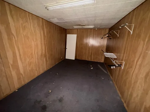 a view of hallway with stainless steel appliances