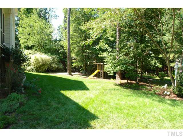 12205 Freemont Lane Raleigh, NC 27613 - Photo 23 of 25 a view of a backyard with a garden and entertaining space