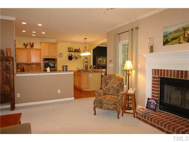 12205 Freemont Lane Raleigh, NC 27613 - Photo 5 of 25 a living room with furniture and a fireplace