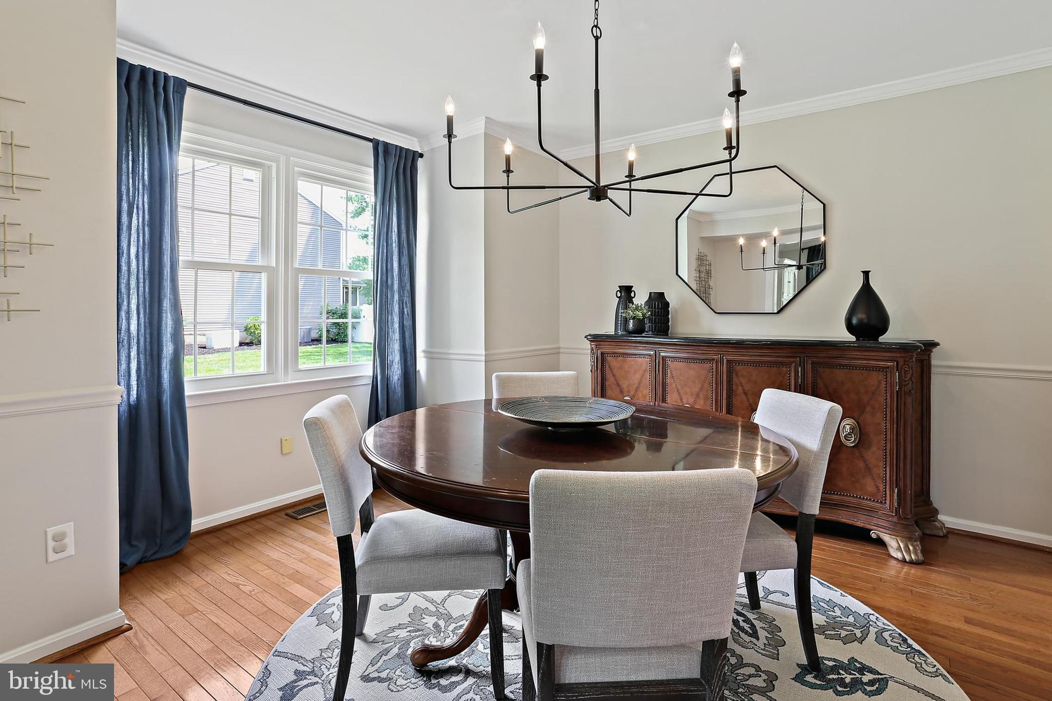2111 Stonewall Road Baltimore, MD 21228 - Photo 6 of 58 a view of a dining room with furniture window and wooden floor