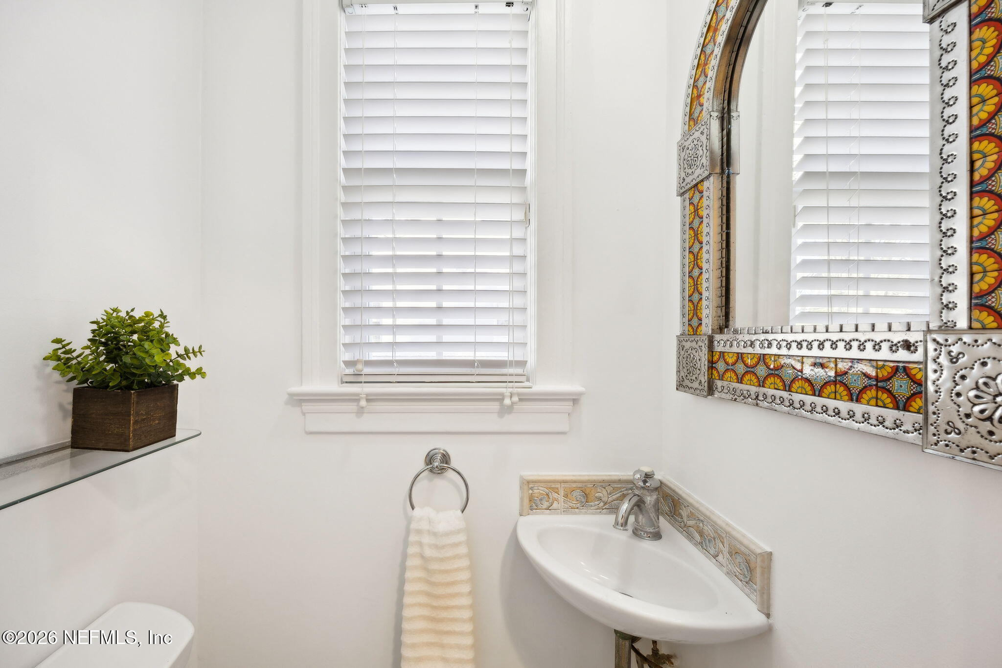 1626 Brookwood Road Jacksonville, FL 32207 - Photo 19 of 98 a bathroom with a sink and a mirror