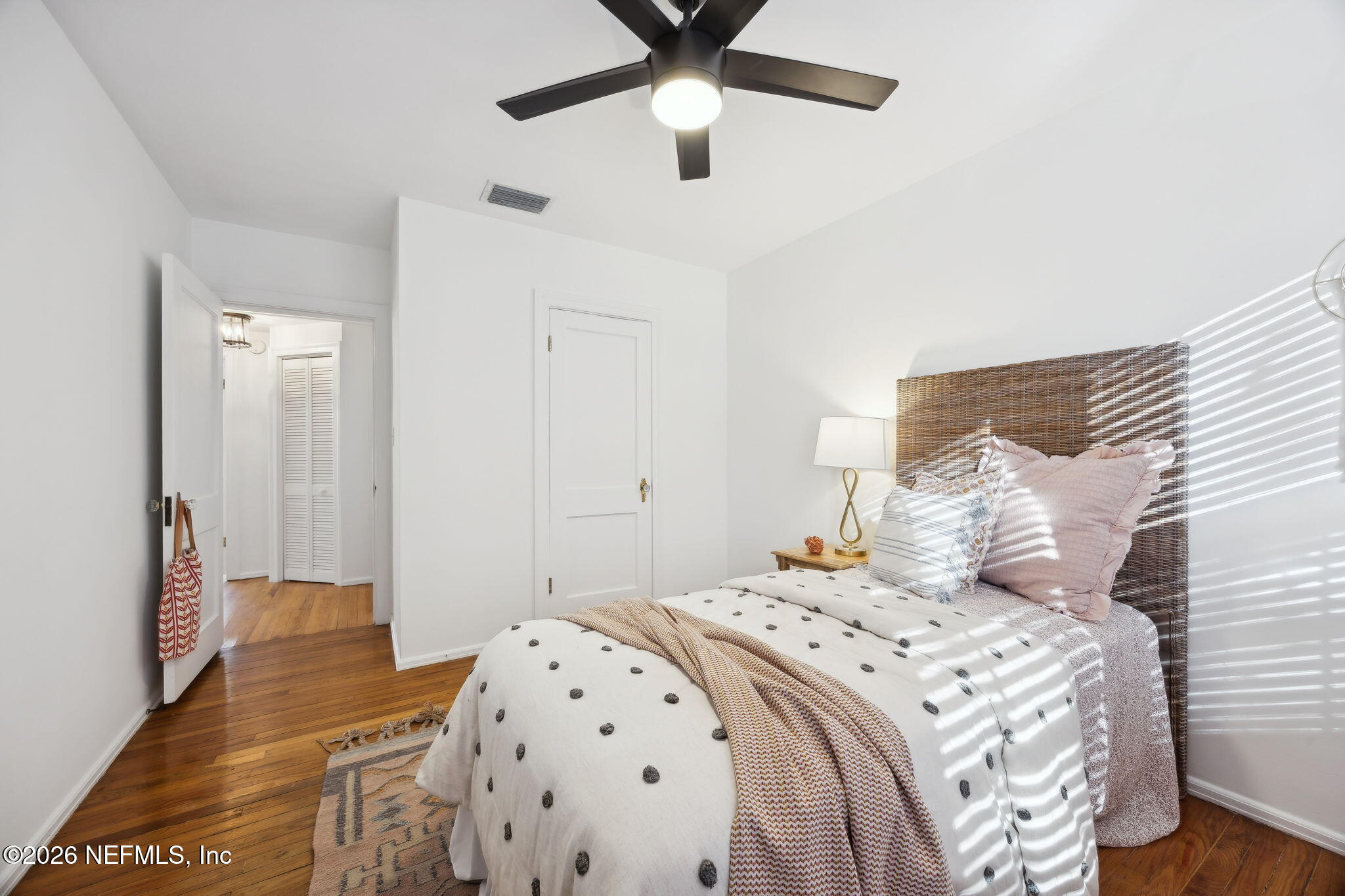 1626 Brookwood Road Jacksonville, FL 32207 - Photo 21 of 98 a bedroom with a large bed and a chandelier